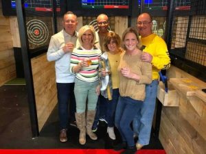 axe throwing bar with golf and multi-sport simulators in Mitchell, South Dakota - featuring projected targets and games
